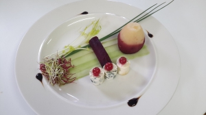 Poached pear in red wine with blue cheese salad